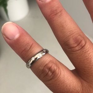 14k white gold Benchmark Nova scattered diamond bezel eternity band. Size 7.